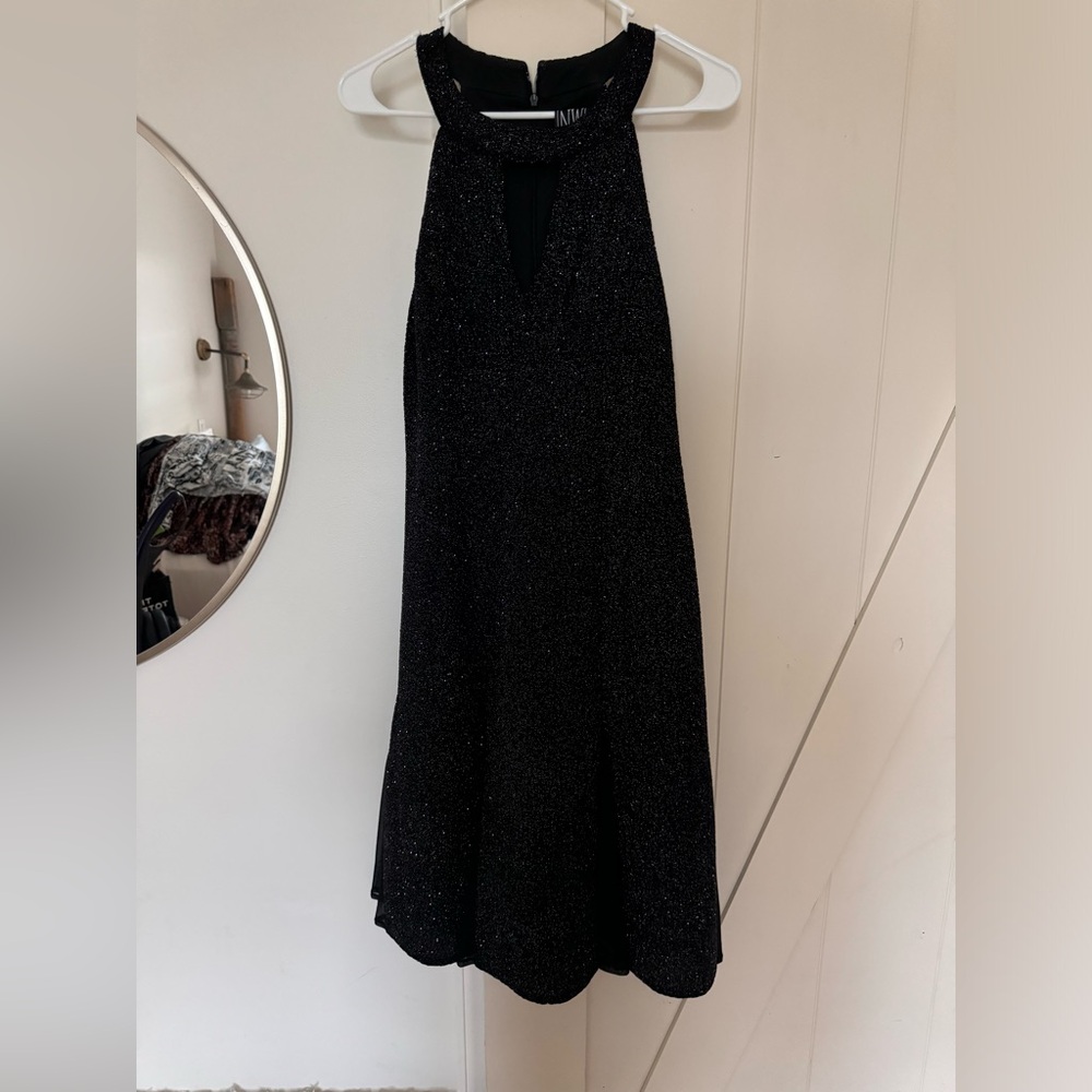 Black sparkly dress with halter neck and flowy bottom